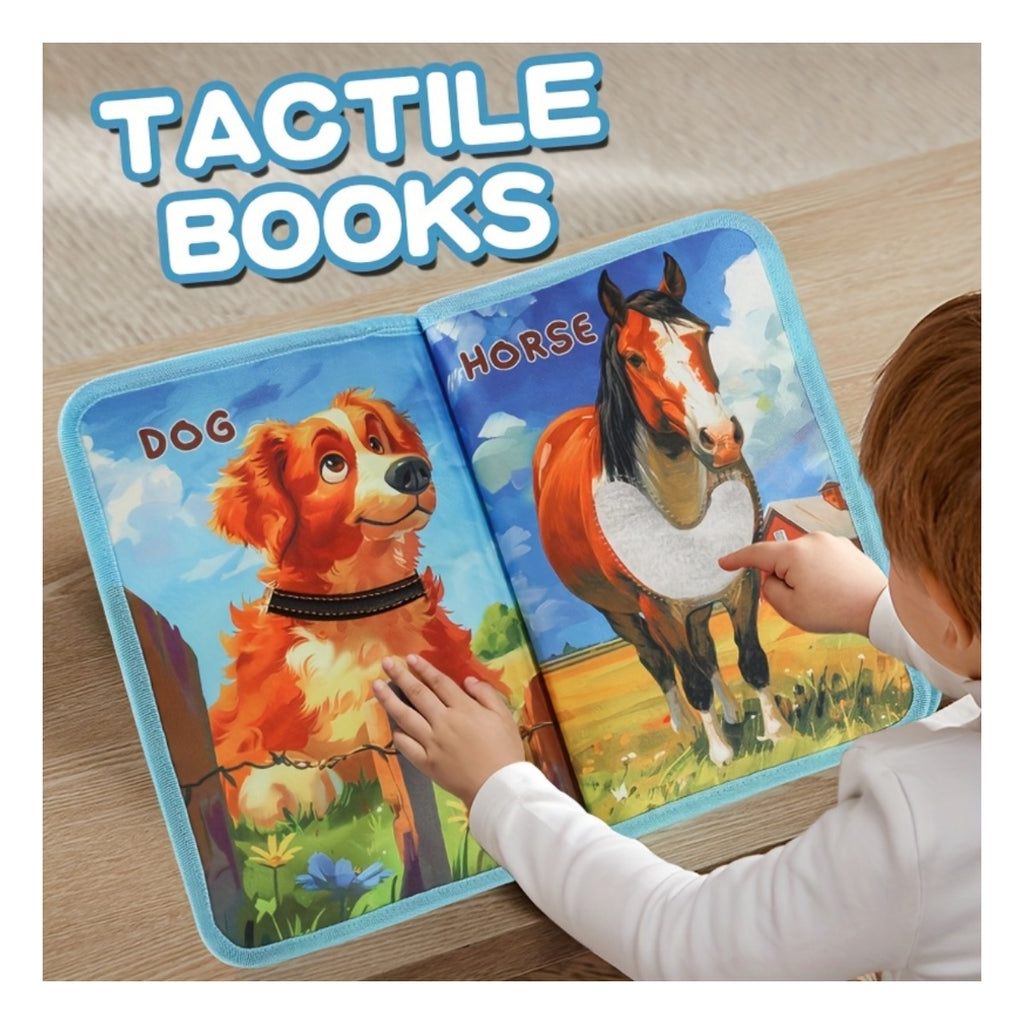 Toddler touching the dog and horse pages of a tactile cloth book