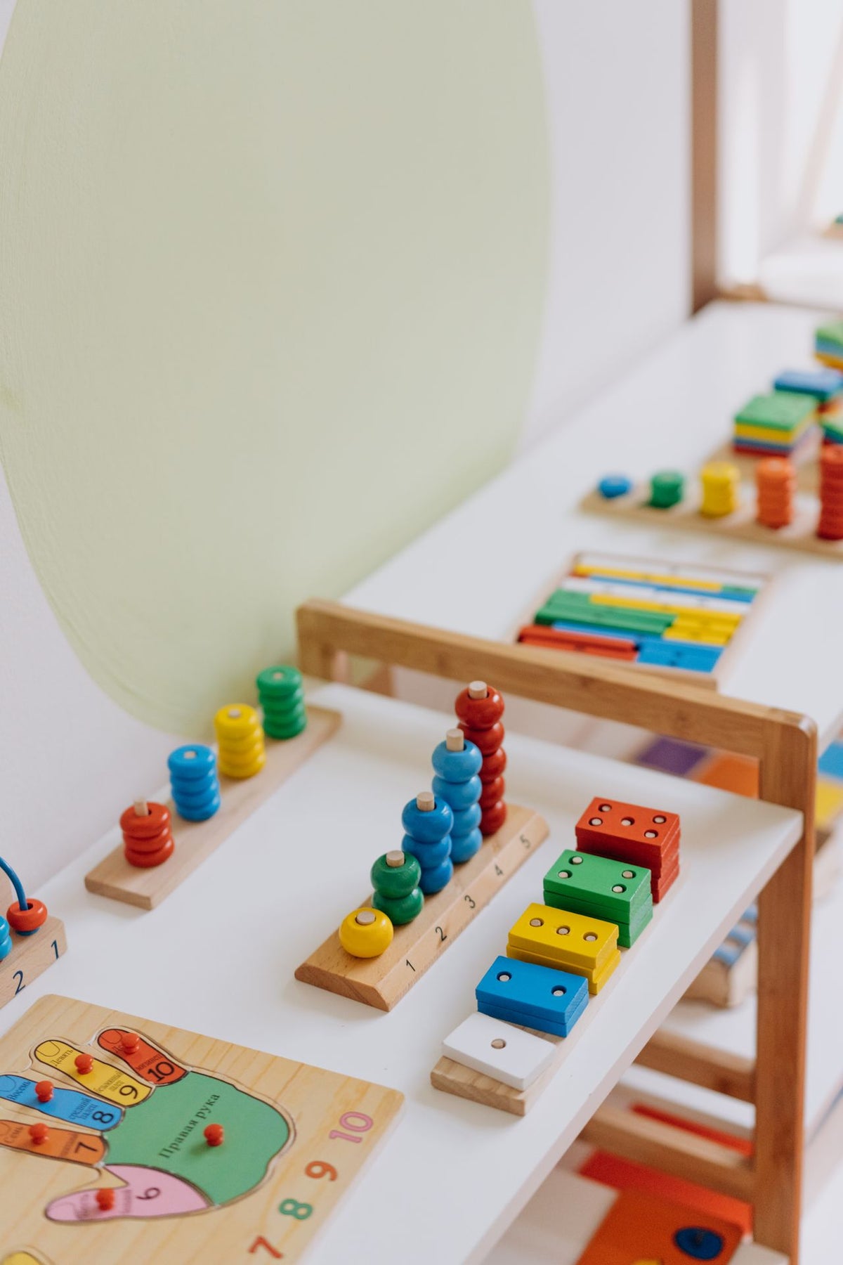 Colourful wooden educational toys on a shelf